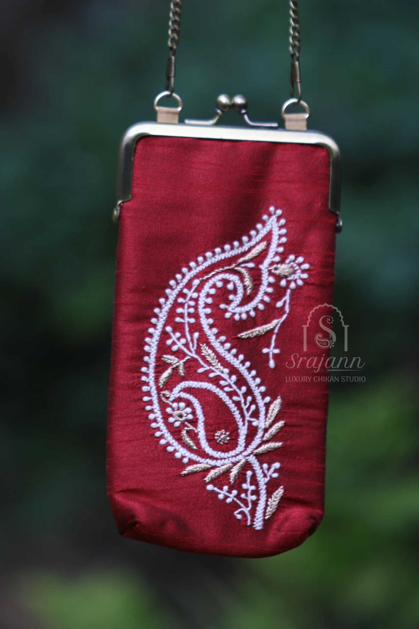 Srajann Hand Embroidered Maroon Silk Lucknowi Chikankari Mobile Cover With Zari Work Srajann Hand Embroidered Maroon Silk Lucknowi Chikankari Mobile Cover With Zari Work